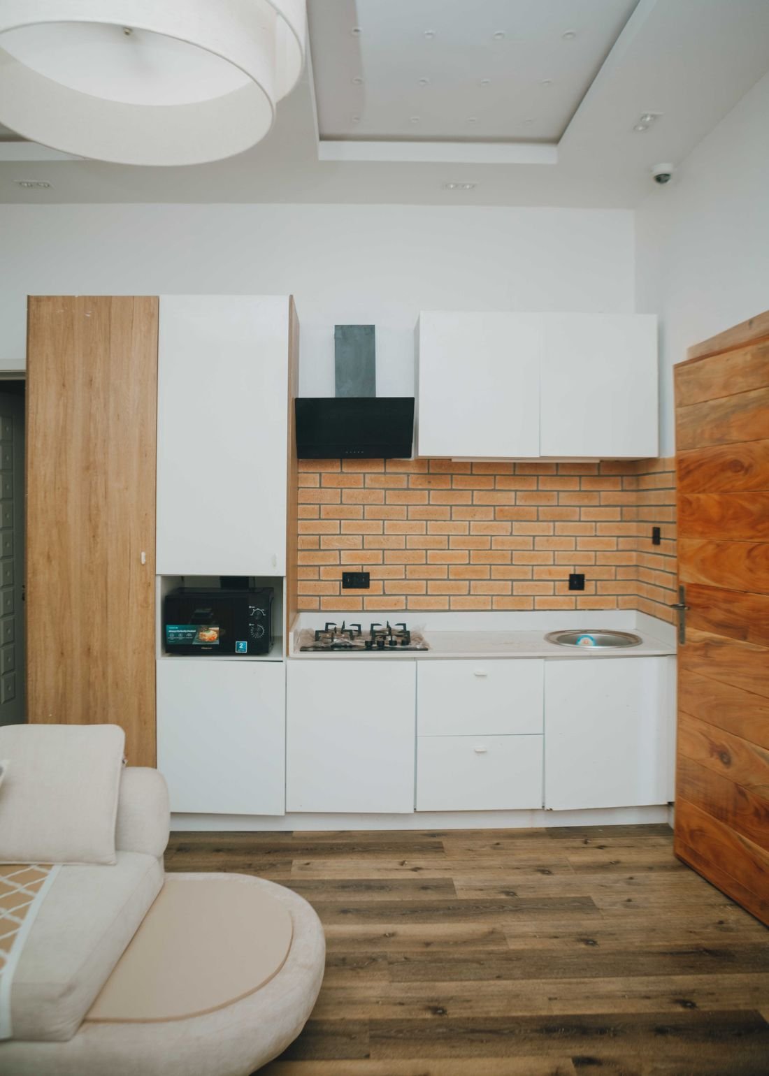A white fitted kitchen with wood accents