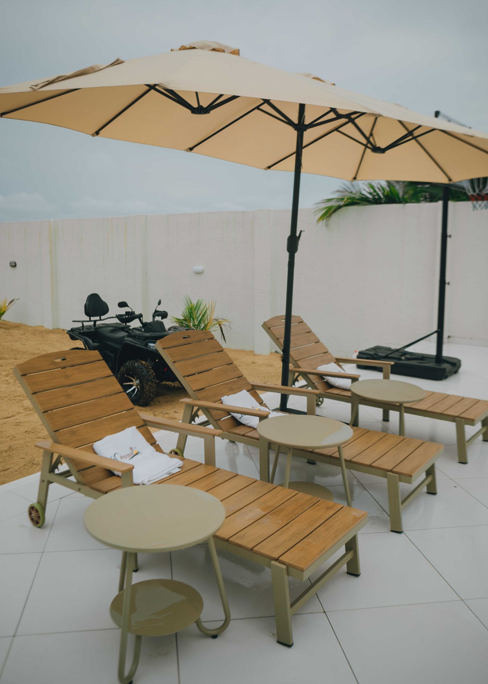 Loungers and parasols beside the pool